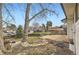 Large backyard featuring mature trees, landscaping and partial fence at 789 Hamal Dr, Lone Tree, CO 80124