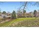 Green backyard with trees and a wooden fence at 789 Hamal Dr, Lone Tree, CO 80124