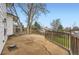 Outdoor patio area with mature trees and a wooden fence at 789 Hamal Dr, Lone Tree, CO 80124
