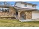 Close-up of the brick entrance, featuring a gated archway and a cozy, inviting entry way on a sunny day at 789 Hamal Dr, Lone Tree, CO 80124