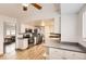 Open kitchen features white cabinets, stainless steel appliances, and hardwood floors at 789 Hamal Dr, Lone Tree, CO 80124