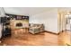 Comfortable living room with hardwood floors, a brick fireplace, and cozy seating at 789 Hamal Dr, Lone Tree, CO 80124
