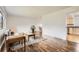 Bright living room featuring hardwood floors, a large window, a gray sofa, and a decorative rug at 789 Hamal Dr, Lone Tree, CO 80124