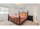 Cozy main bedroom features a bed with a wooden frame and neutral-colored bedding at 789 Hamal Dr, Lone Tree, CO 80124