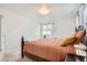 Comfortable bedroom with a wooden frame bed and soft, neutral-toned bedding at 789 Hamal Dr, Lone Tree, CO 80124