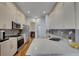 Modern kitchen featuring sleek cabinets, stainless steel appliances, and a stylish countertop at 6145 S Paris St, Greenwood Village, CO 80111