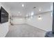 The finished basement features recessed lights, a carpeted staircase, and a wood-burning stove at 3630 W Saratoga Ave, Littleton, CO 80123