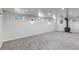 The finished basement features recessed lights, a wood-burning stove, and three windows at 3630 W Saratoga Ave, Littleton, CO 80123