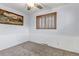 Bedroom with hardwood windows, trim and a painting on the wall at 3630 W Saratoga Ave, Littleton, CO 80123