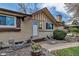 Front entrance of a brick single Gathering home with brown trim and landscaped front yard at 3630 W Saratoga Ave, Littleton, CO 80123