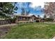 Attractive single-Gathering home featuring a green lawn, brick facade, and mature trees at 3630 W Saratoga Ave, Littleton, CO 80123