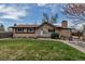 Charming single-story home boasts a well-manicured lawn and inviting curb appeal at 3630 W Saratoga Ave, Littleton, CO 80123