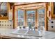 Kitchen sink with a view looking out to the backyard, custom wood cabinets, and white countertops at 3630 W Saratoga Ave, Littleton, CO 80123