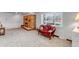 Living room with a brick fireplace and vintage red velvet settee at 3630 W Saratoga Ave, Littleton, CO 80123