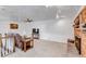 Cozy living room with brick fireplace, carpet flooring, recessed lighting, and comfortable seating at 3630 W Saratoga Ave, Littleton, CO 80123
