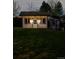 Exterior shot of an outbuilding with lighting, nestled within a grassy area at 3630 W Saratoga Ave, Littleton, CO 80123