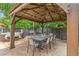 Backyard boasts an outdoor dining area, hot tub, barbecue grill and privacy fence creating a relaxing outdoor space at 12256 W 34Th Pl, Wheat Ridge, CO 80033