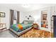 Cozy bedroom with a large bed, stylish decor, and a soft rug, providing a comfortable and inviting space at 12256 W 34Th Pl, Wheat Ridge, CO 80033