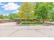 Inviting home with lush lawn, mature trees, and inviting front yard landscaping creates an appealing curb appeal at 12256 W 34Th Pl, Wheat Ridge, CO 80033