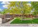 Charming brick home with mature tree, green lawn, and inviting curb appeal at 12256 W 34Th Pl, Wheat Ridge, CO 80033