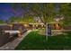 Charming brick home with lush lawn, mature trees, and for sale sign at 12256 W 34Th Pl, Wheat Ridge, CO 80033