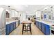 Modern kitchen features with stainless steel appliances, light countertops, and a central island at 12256 W 34Th Pl, Wheat Ridge, CO 80033