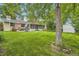 Expansive backyard with patio, lush lawn and screened in patio, perfect for outdoor gatherings at 6940 W 63Rd Ave, Arvada, CO 80003