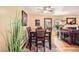 Dining room with hardwood floors, dining table and access to living room at 6940 W 63Rd Ave, Arvada, CO 80003