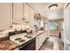 Well-maintained kitchen with bright cabinetry, ample countertop space, and modern appliances at 6940 W 63Rd Ave, Arvada, CO 80003