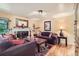 Cozy living room with a fireplace, hardwood floors, and comfortable seating at 6940 W 63Rd Ave, Arvada, CO 80003