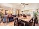 Open-concept living space showcasing hardwood floors and sightlines into the kitchen at 6940 W 63Rd Ave, Arvada, CO 80003
