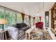 Bright sunroom with lots of natural light featuring comfortable seating at 6940 W 63Rd Ave, Arvada, CO 80003