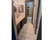 Full bathroom featuring a shower and vanity with dark cabinets at 3550 S Harlan St # 313, Denver, CO 80235
