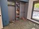 Neutral bedroom features a closet with built in shelving and gray carpet at 3550 S Harlan St # 313, Denver, CO 80235