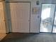 Bedroom with closet doors and view of room with patio chairs at 3550 S Harlan St # 313, Denver, CO 80235