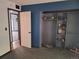 Bedroom with gray carpet and a closet with built in shelving at 3550 S Harlan St # 313, Denver, CO 80235