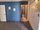 Carpeted bedroom with closet and door to the bathroom at 3550 S Harlan St # 313, Denver, CO 80235