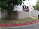 Attractive townhouse exterior featuring a fenced patio adorned with colorful decorations at 3550 S Harlan St # 313, Denver, CO 80235