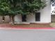 Charming two-story home with tidy landscaping, mulched area, and tree at 3550 S Harlan St # 313, Denver, CO 80235