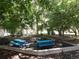 Charming picnic area surrounded by mature trees and lush greenery for outdoor dining and relaxation at 3550 S Harlan St # 313, Denver, CO 80235