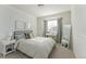 Bright, comfortable bedroom featuring soft, neutral decor and a vanity by the window at 1919 Breen Ln, Superior, CO 80027