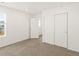 This is a bedroom with carpet and good closet space at 547 Homestead Ave, Brighton, CO 80601