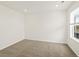 This bedroom offers natural light, plush carpeting, and modern recessed lighting at 547 Homestead Ave, Brighton, CO 80601