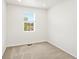 Light-filled bedroom with plush carpet, neutral walls, a bright window, and ample natural light at 547 Homestead Ave, Brighton, CO 80601