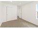 Light-filled bedroom boasts carpeted floors and a large closet at 547 Homestead Ave, Brighton, CO 80601