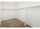 Spacious walk-in closet featuring ample storage with shelving and a neutral color palette at 547 Homestead Ave, Brighton, CO 80601