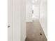Bright hallway showcasing neutral carpet and white walls, creating a seamless transition between rooms at 547 Homestead Ave, Brighton, CO 80601