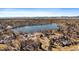 Aerial view of the neighborhood with a large lake at 8699 Garrison Ct, Arvada, CO 80005