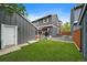 This backyard has grass, a fence, and a patio at 8699 Garrison Ct, Arvada, CO 80005