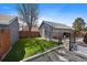 Landscaped backyard with new turf, detached garage and fenced yard, perfect for outdoor living and entertaining at 8699 Garrison Ct, Arvada, CO 80005